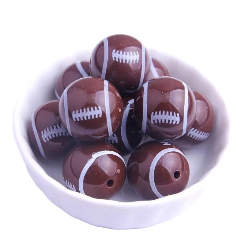 #398- 12mm “Football” Acrylic Beads (20 Count)