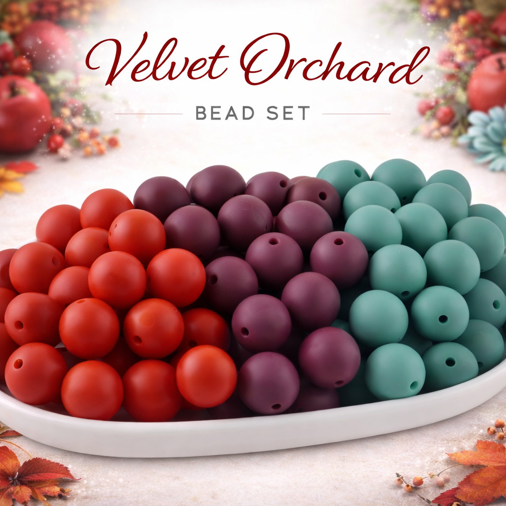 Bead set with red, purple, and teal beads on a white plate, labeled 'Velvet Orchard'.