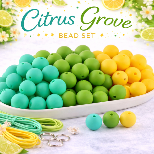 Bead set with green, yellow, and turquoise beads on a white plate, surrounded by lemons and limes.